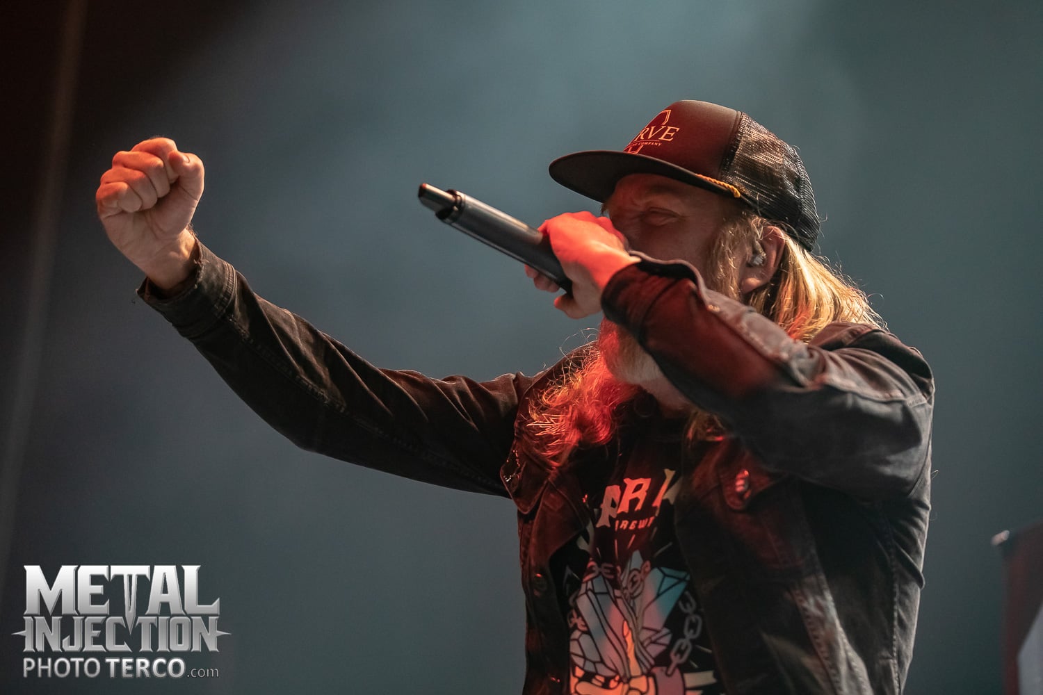 Tomas Lindberg, vocalist of At The Gates, performing live on stage with powerful stage presence.