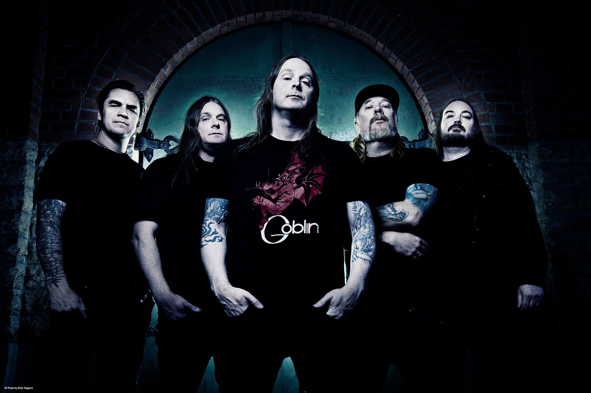 Members of At the Gates posed together in a staged, professional promotional photo.