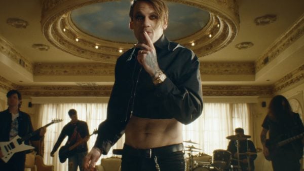 Caleb Shomo performing in the music video for Free by Beartooth.