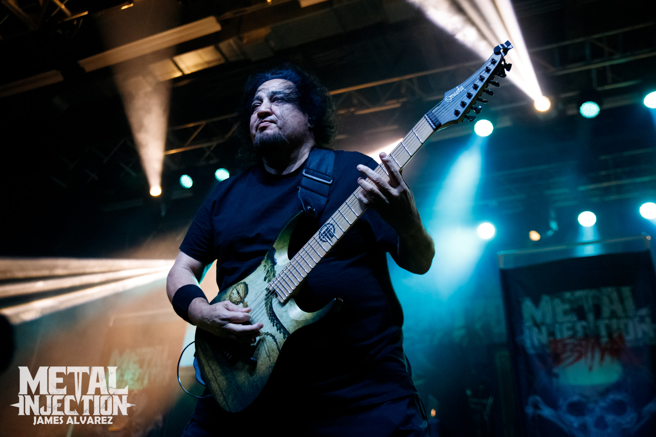 A photo of Dino Cazares playing with Fear Factory.