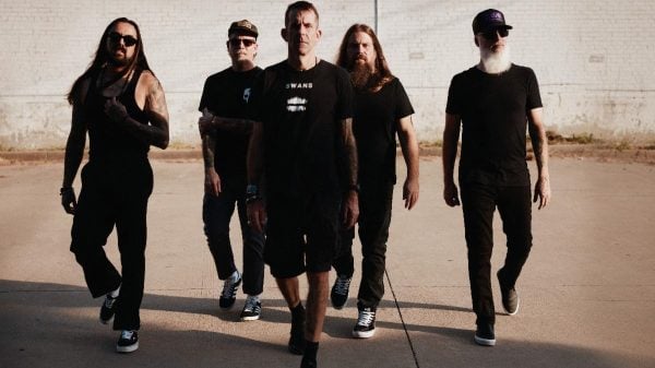 Promotional photo of Lamb of God featuring all five band members posed together in a studio setting