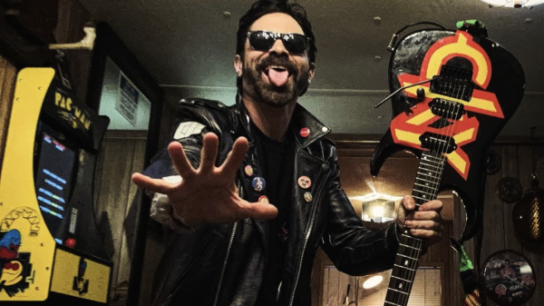 Chad I Ginsburg of CKY posing with electric guitar